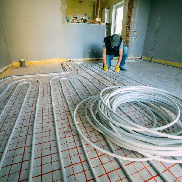 Pipefitter installing system of heating. Repair in the apartment